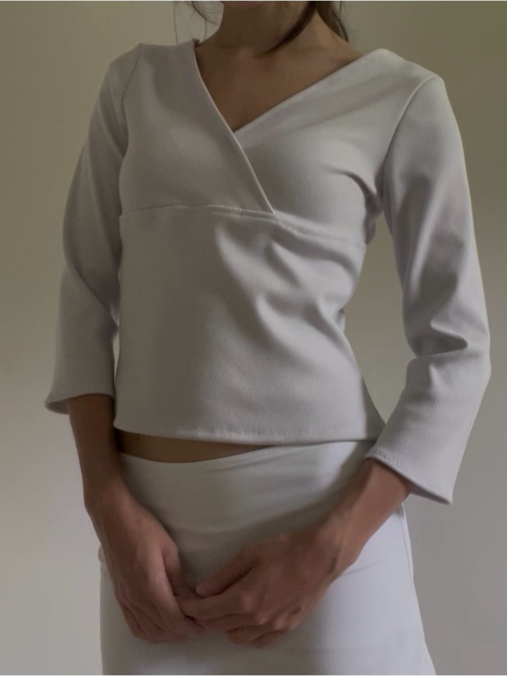 Grey three-quarter sleeve ribbed knit wrap top